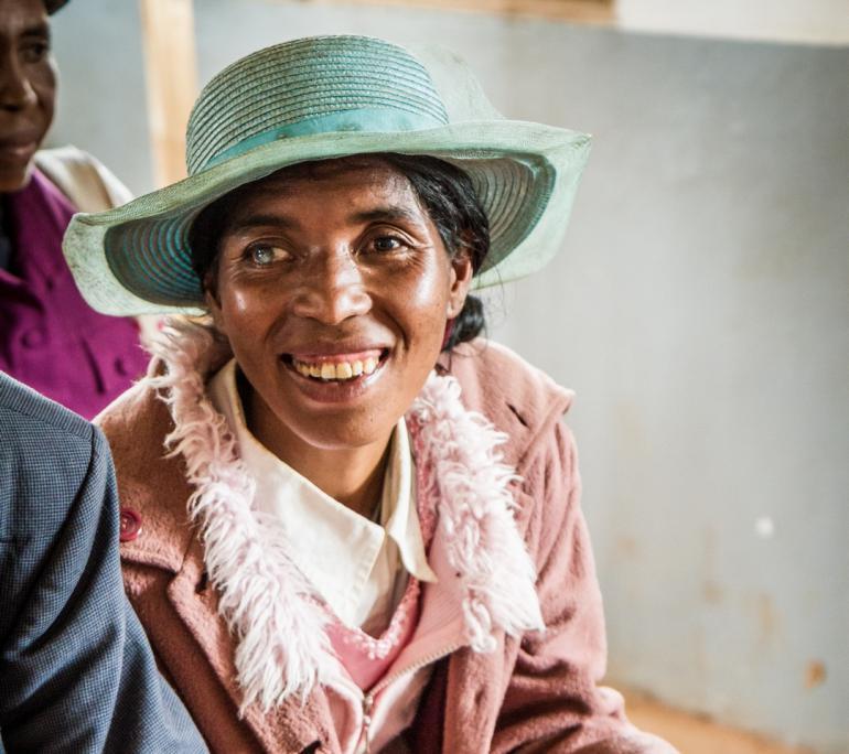 malagasy women with a visible cataract in her left eye looking at the camera and smiling 