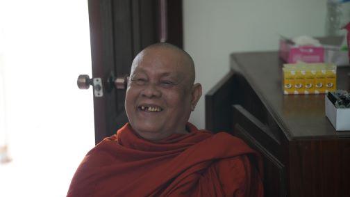 Doung Loum Buddhist Monk in Cambodia smiling after patch removed photo by Dr. John Judson.jpg