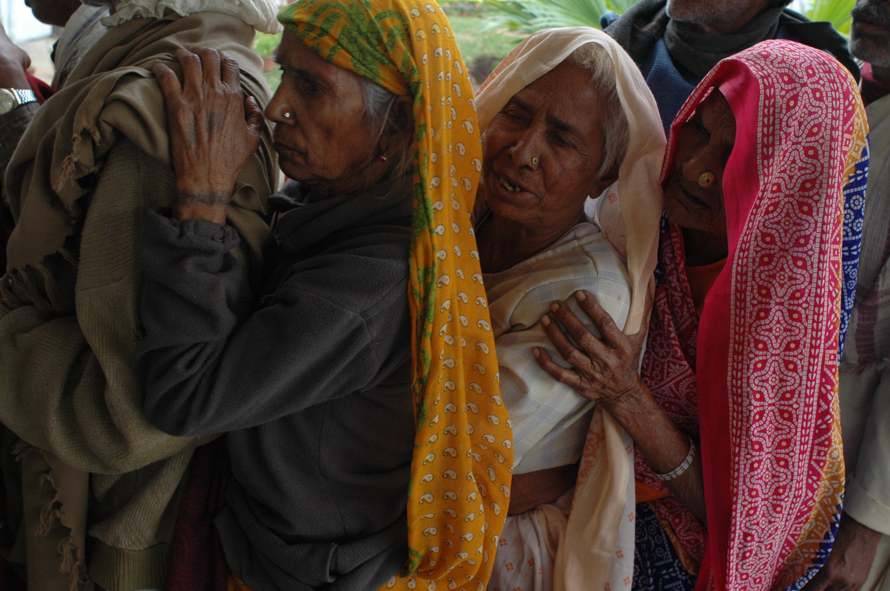 Line of women receiving eye care, Chitrakoot, India. Photo by Brian Harris. 
