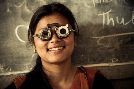 Nepali girl wearing refractive error test lenses 