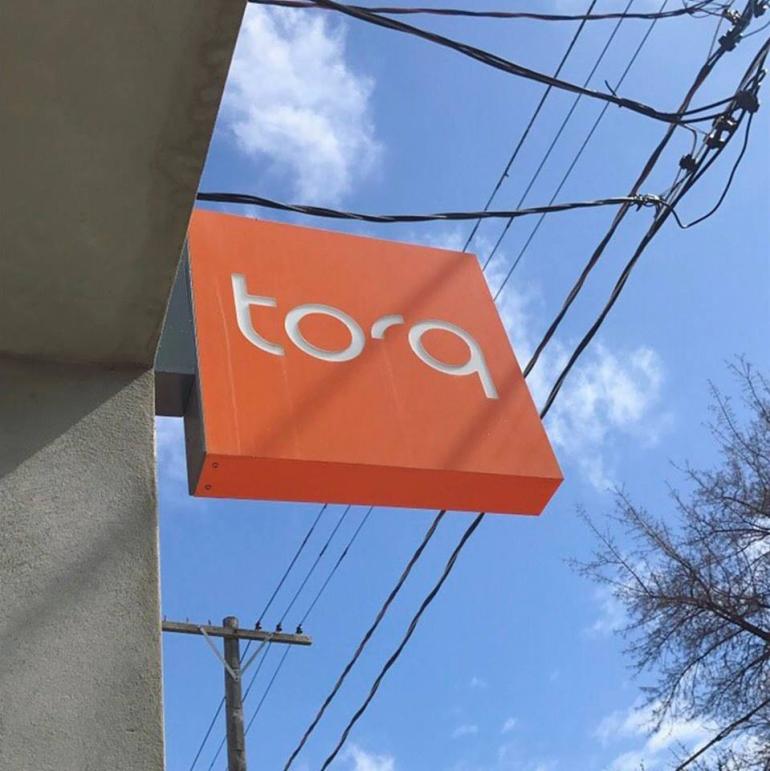 picture of Torq Ride sign outside studio