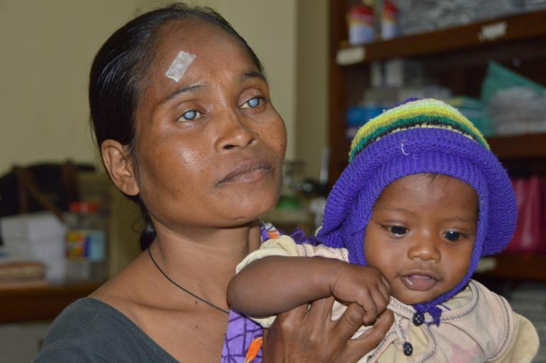 Sabitri blind holding baby Lakshmi