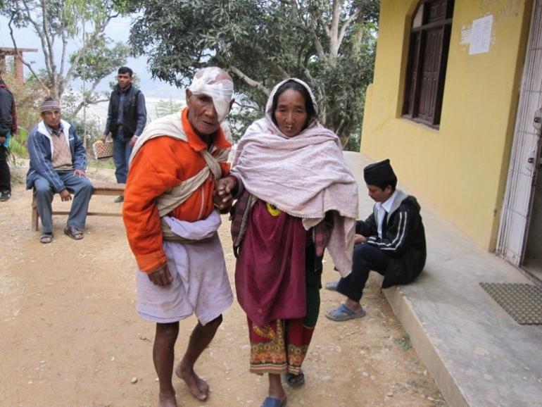 Pale Nepal Male Cataract Patient After surgery Being Led By Wife