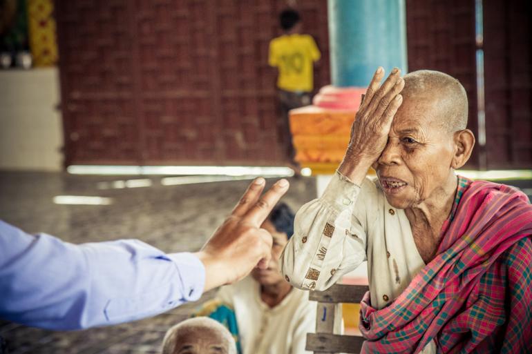 Cambodian woman eye test by Ellen Crystal