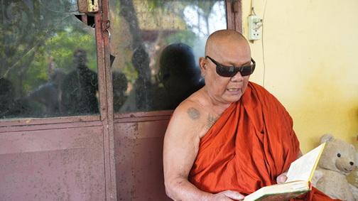 Doung Loum Cambodian Monk Reading the sacred text by Dr, John Judson.jpg
