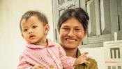 Cambodian Mother and Baby at Eye Screening by Ellen Crystal