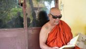 Doung Loum Cambodian Monk Reading the sacred text 