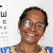 School principal in Madagascar wearing her new glasses at a Community Eye Centre