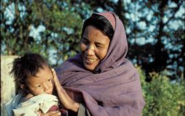 Nepali Mother seeing her son for the first time by Dr. Marty Spencer