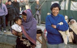 Nepali Mother seeing her son for the first time with husband and daughter by Dr. Marty Spencer