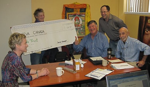 Susan presents the cheque to the Seva Canada Executive