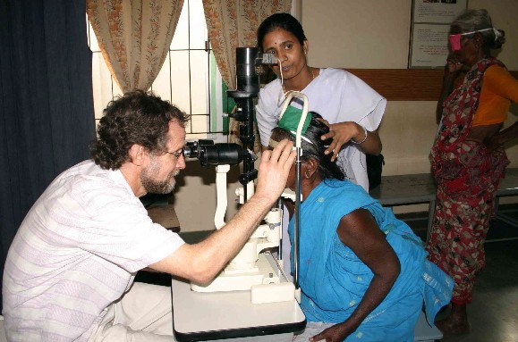 Ophthalmologist Dr Martin Spencer examines a patient