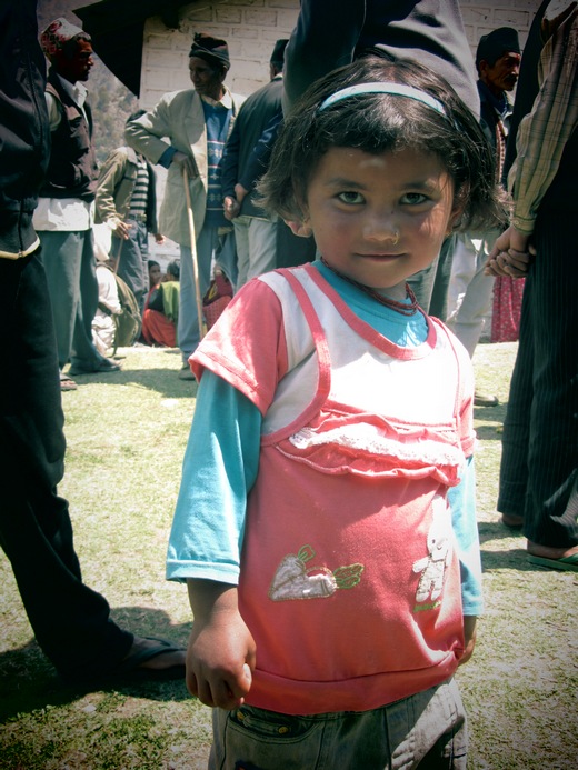 Little girl in Bajura, Nepal looking at camera and smiling